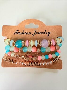 Multi-colored beaded bracelets with pink, blue, and white beads #beaded #bracele